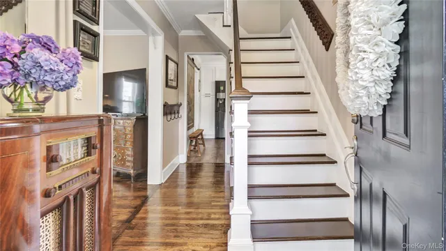 a view of an entryway with wooden floor