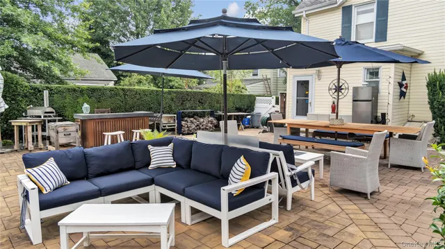 a backyard of a house with table and chairs
