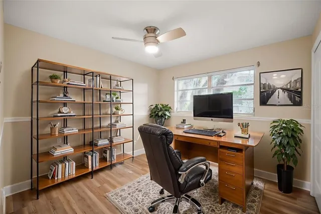 a workspace with furniture window and wooden floor