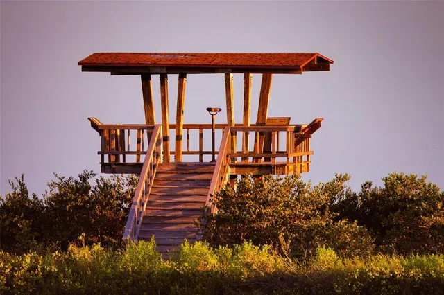 a front view of a house with staircase and wooden floor