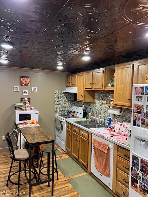 2855 Long Run Road Cairo, WV 26337 - Photo 10 of 25 Kitchen with range, sink, dishwashing machine, light wood-type flooring, and fridge
