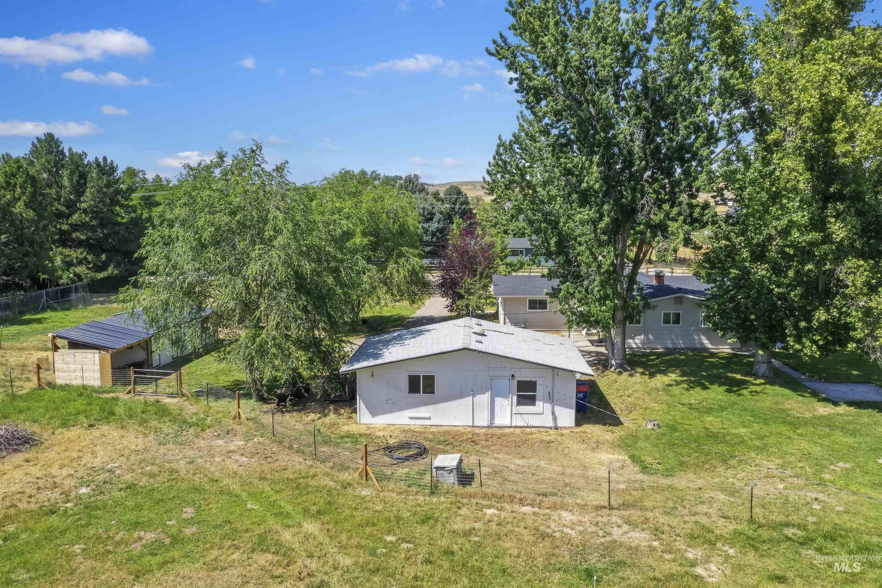355 East Beacon Light Road Eagle, ID 83616 - Photo 45 of 47 White exterior structure with a light-colored metal roof