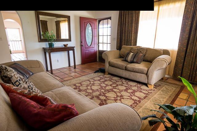 17 Holopuni Road Kula, HI 96790 - Photo 12 of 30 a living room with furniture and a window