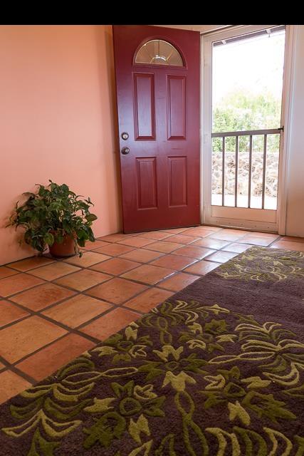 17 Holopuni Road Kula, HI 96790 - Photo 14 of 30 a view of a livingroom with wooden floor and a window