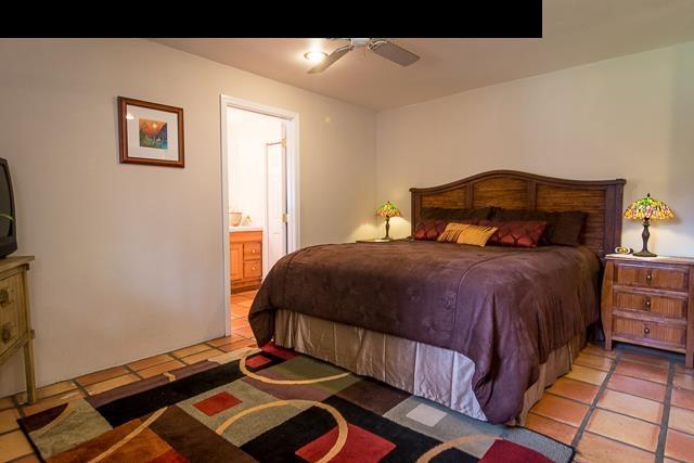 17 Holopuni Road Kula, HI 96790 - Photo 18 of 30 a bedroom with a bed and a window