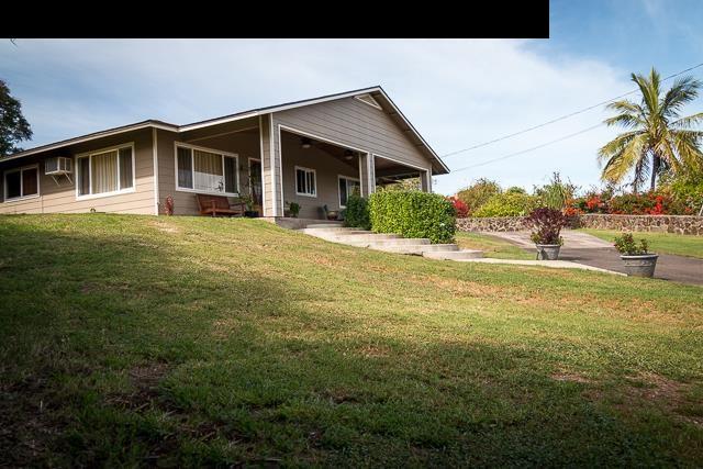 17 Holopuni Road Kula, HI 96790 - Photo 2 of 30 a front view of a house with a yard and porch