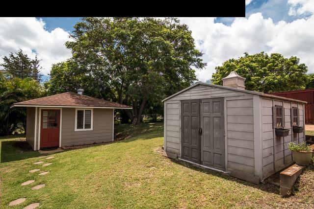 17 Holopuni Road Kula, HI 96790 - Photo 24 of 30 a front view of a house with a yard and garage