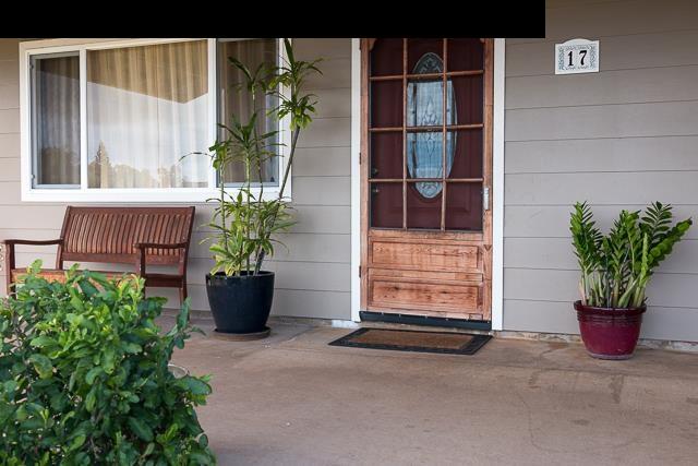 17 Holopuni Road Kula, HI 96790 - Photo 4 of 30 a potted plant sitting in front of a house with potted plants