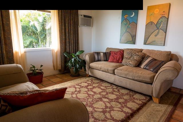 17 Holopuni Road Kula, HI 96790 - Photo 10 of 30 a living room with furniture and a large window