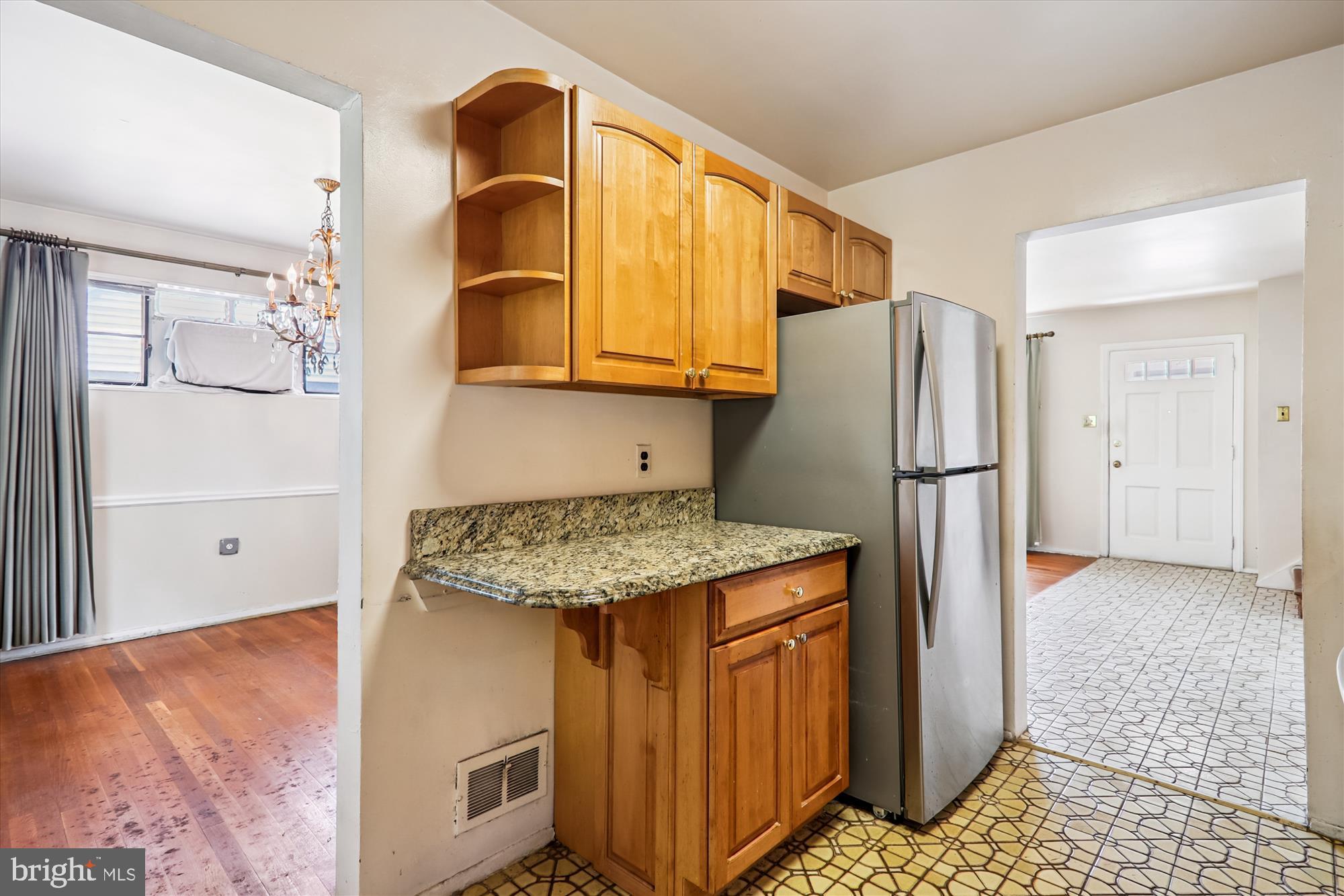 9507 Adelphi Road Silver Spring, MD 20903 - Photo 14 of 41 a kitchen with stainless steel appliances granite countertop a refrigerator and a stove