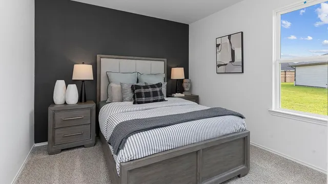 a bedroom with a bed and a window