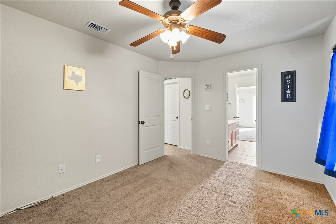 2411 Settlement Road Copperas Cove, TX 76522 - Photo 21 of 38 a view of a livingroom with a ceiling fan and entryway