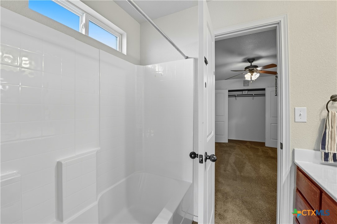 2411 Settlement Road Copperas Cove, TX 76522 - Photo 24 of 38 a bathroom with a granite countertop shower