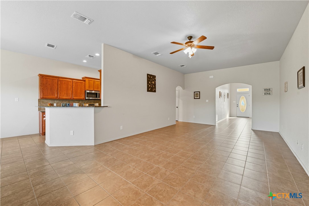 2411 Settlement Road Copperas Cove, TX 76522 - Photo 3 of 38 a view of a kitchen with a sink and a refrigerator