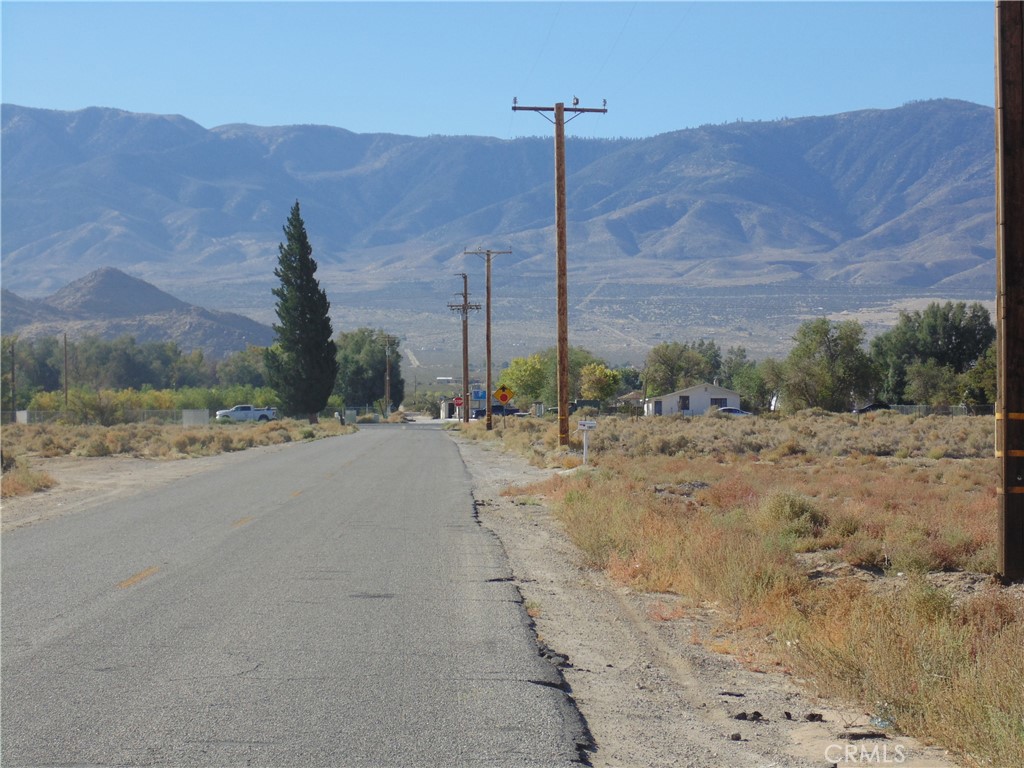 10650 Kendall Road Lucerne Valley, CA 92356 - Photo 5 of 6 a view of a road with a mountain in the background