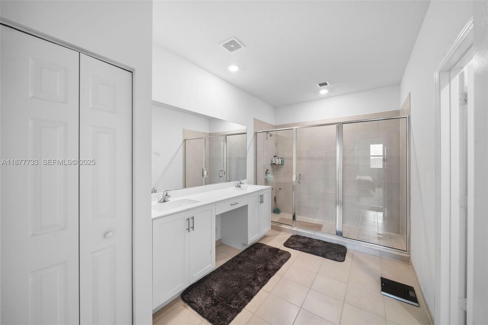 12833 Southwest 229th Terrace Miami, FL 33170 - Photo 25 of 43 a bathroom with a double vanity sink toilet and shower