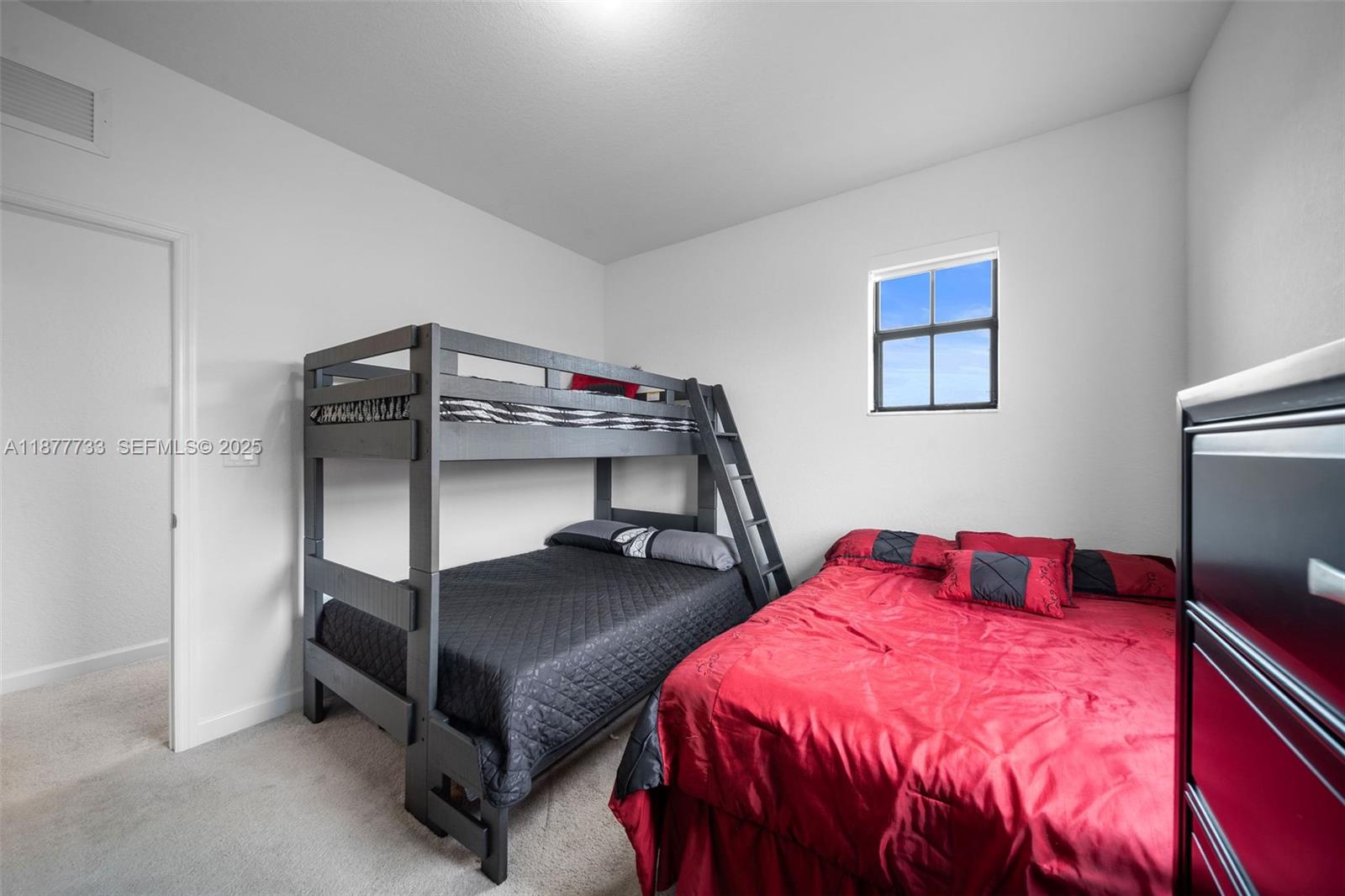 12833 Southwest 229th Terrace Miami, FL 33170 - Photo 29 of 43 a bedroom with a bed and a tv