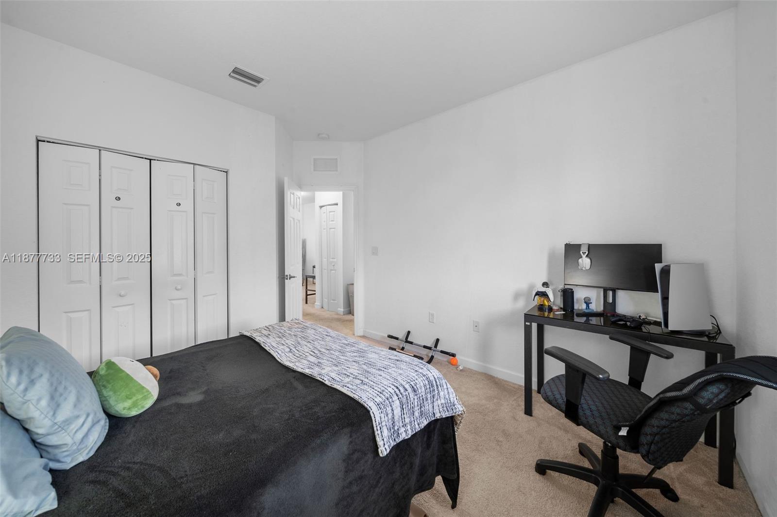 12833 Southwest 229th Terrace Miami, FL 33170 - Photo 40 of 43 a bedroom with a bed and chair