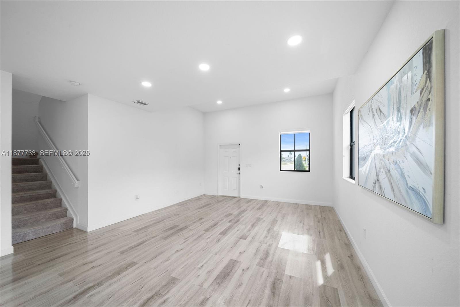 12833 Southwest 229th Terrace Miami, FL 33170 - Photo 5 of 43 wooden floor in an empty room with a window