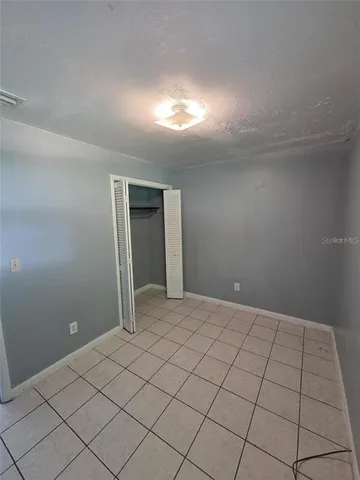 a kitchen with a refrigerator and a stove
