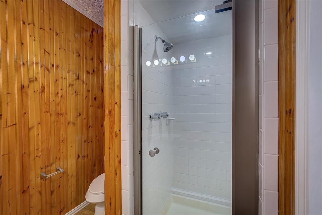 1004 Pecan Avenue Wills Point, TX 75169 - Photo 13 of 21 a bathroom with a glass shower door