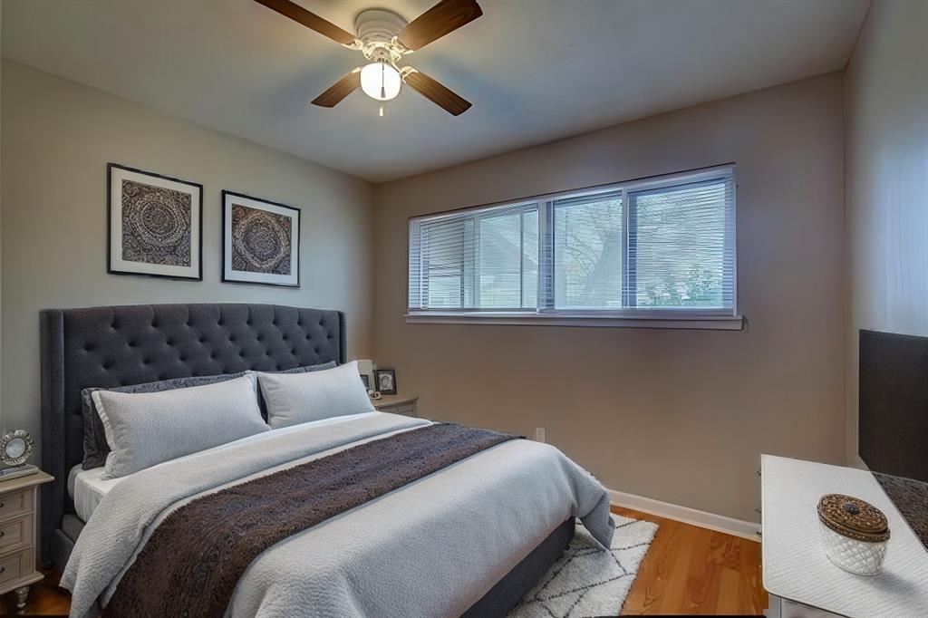 1004 Pecan Avenue Wills Point, TX 75169 - Photo 14 of 21 a bedroom with a large bed and a window