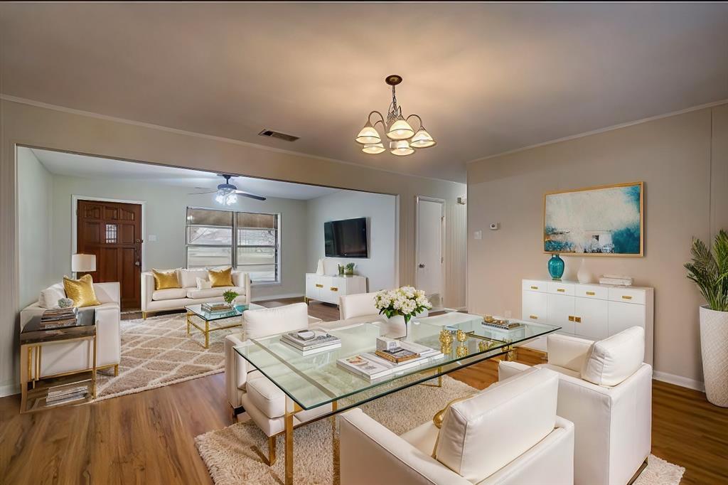 1004 Pecan Avenue Wills Point, TX 75169 - Photo 2 of 21 a view of a dining room with furniture wooden floor and chandelier