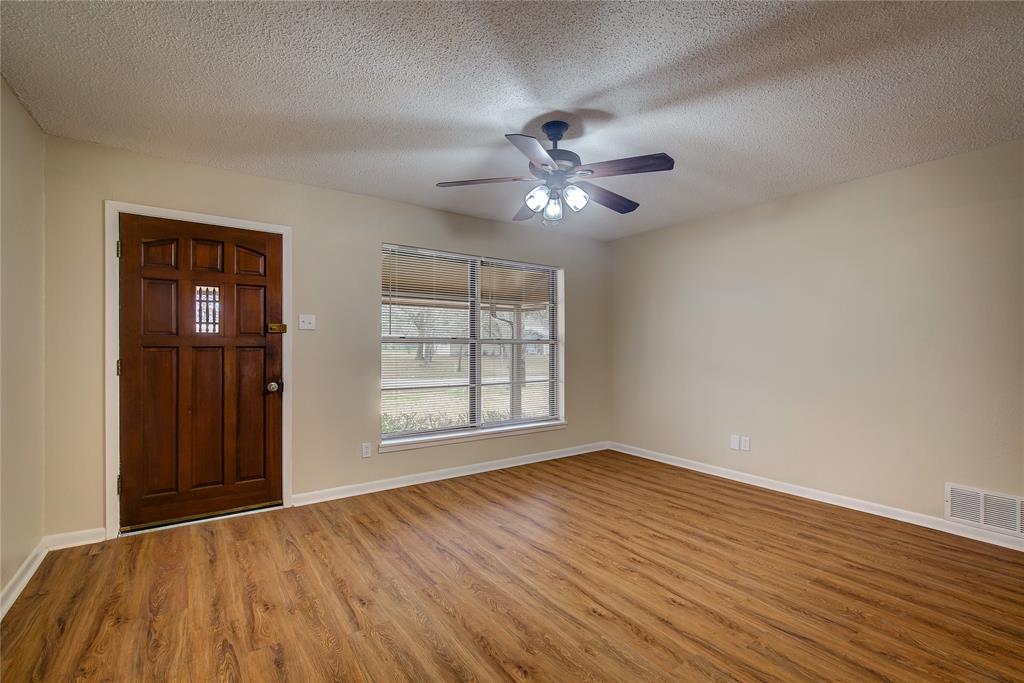 1004 Pecan Avenue Wills Point, TX 75169 - Photo 5 of 21 a view of empty room with wooden floor and fan