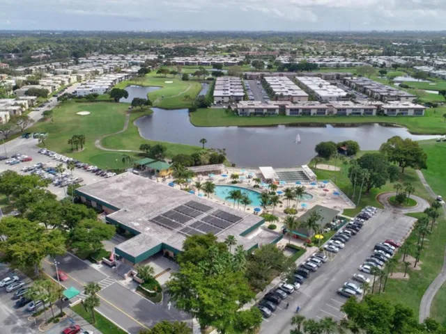 an aerial view of residential houses with outdoor space