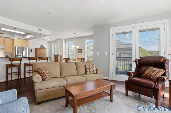 a view of a dining room with furniture and wooden floor
