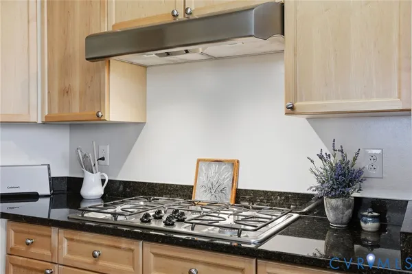 a bathroom with a granite countertop sink a mirror a shower and a bathtub