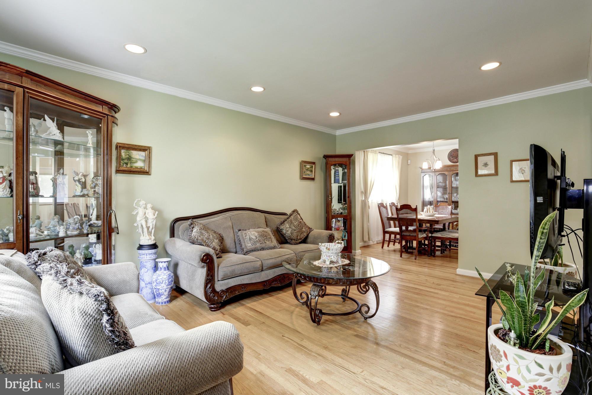 1305 Oakview Drive Silver Spring, MD 20903 - Photo 2 of 26 a living room with furniture and wooden floor