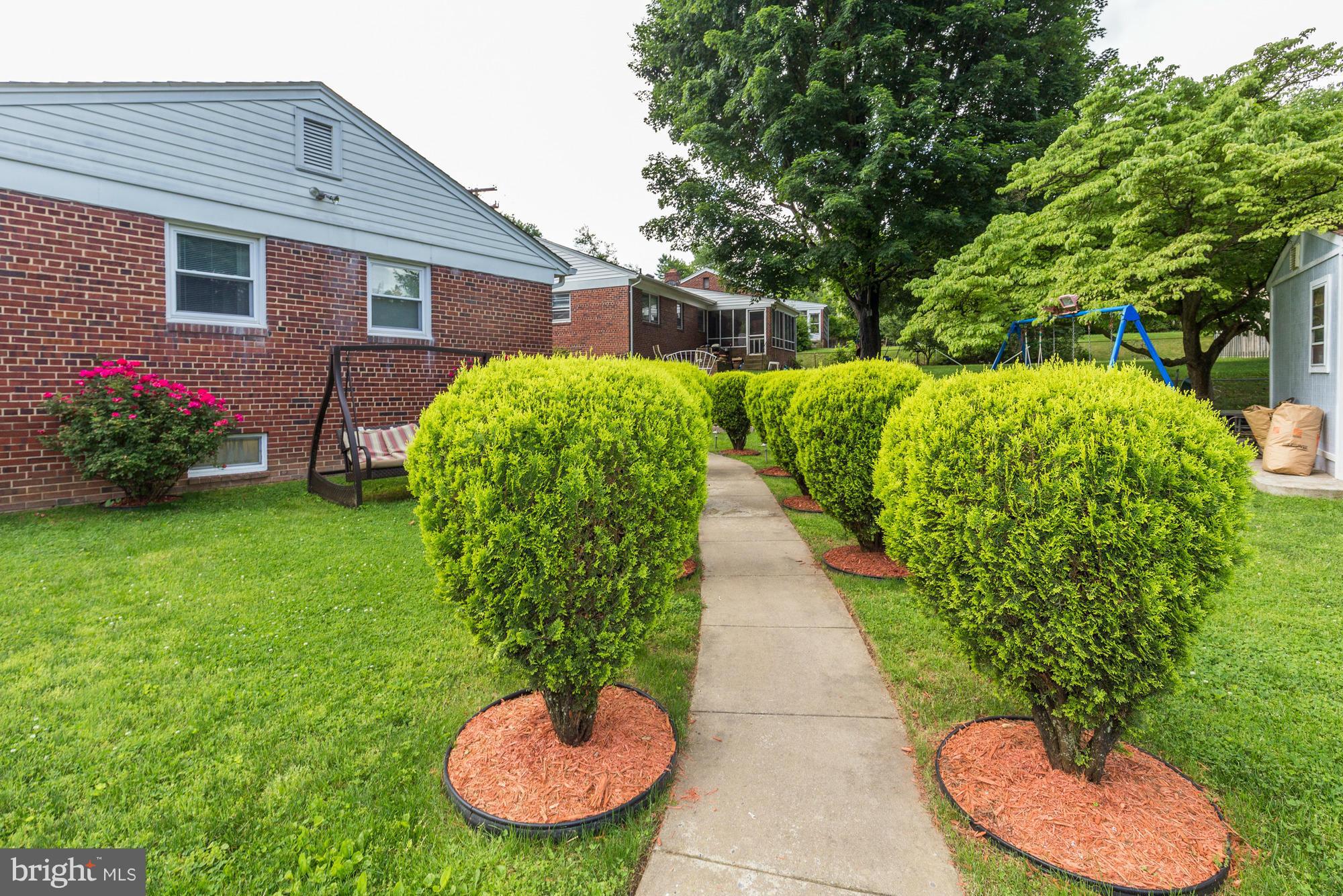 1305 Oakview Drive Silver Spring, MD 20903 - Photo 26 of 26 a view of a backyard with potted plants