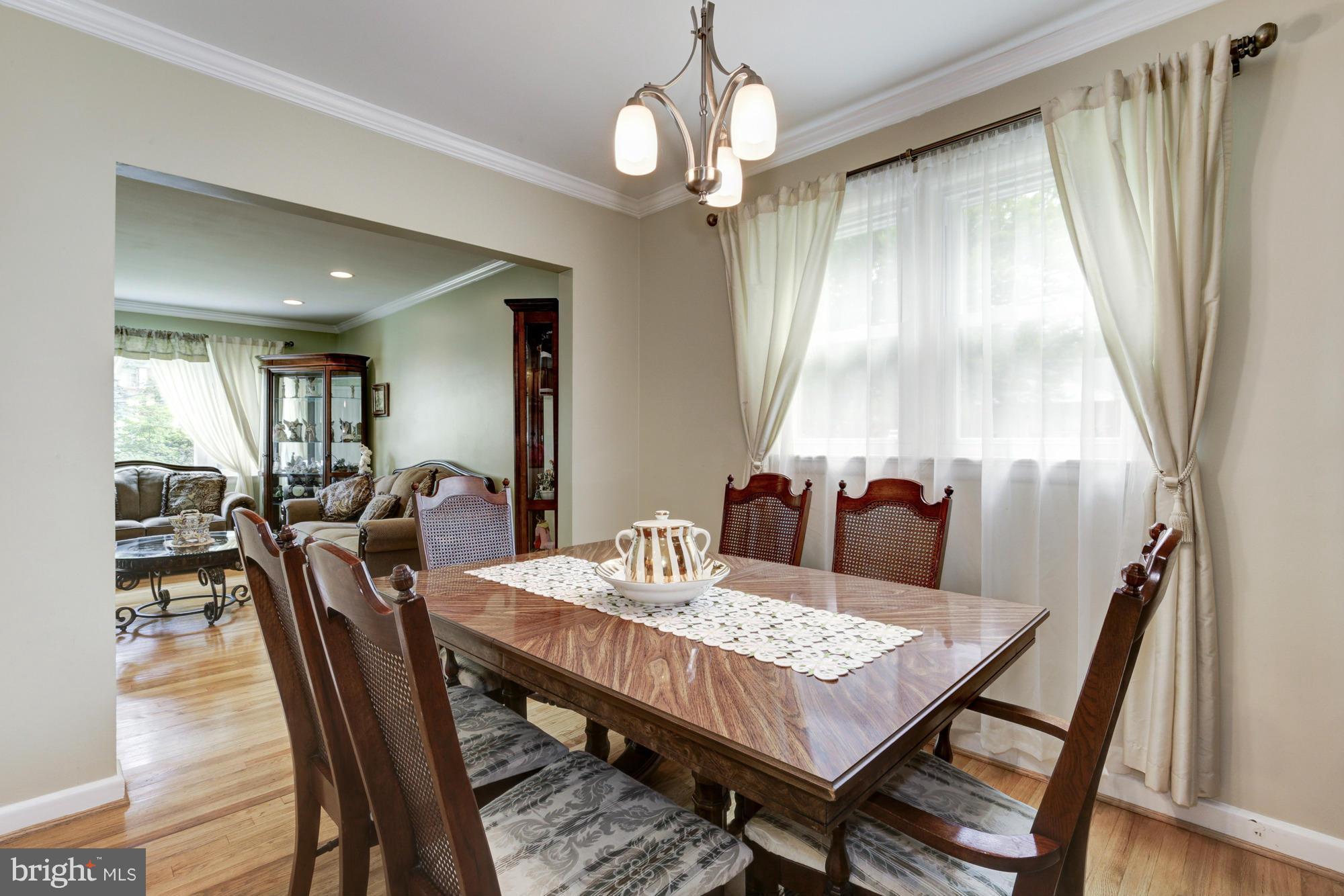 1305 Oakview Drive Silver Spring, MD 20903 - Photo 6 of 26 a view of a dining room with furniture window and wooden floor