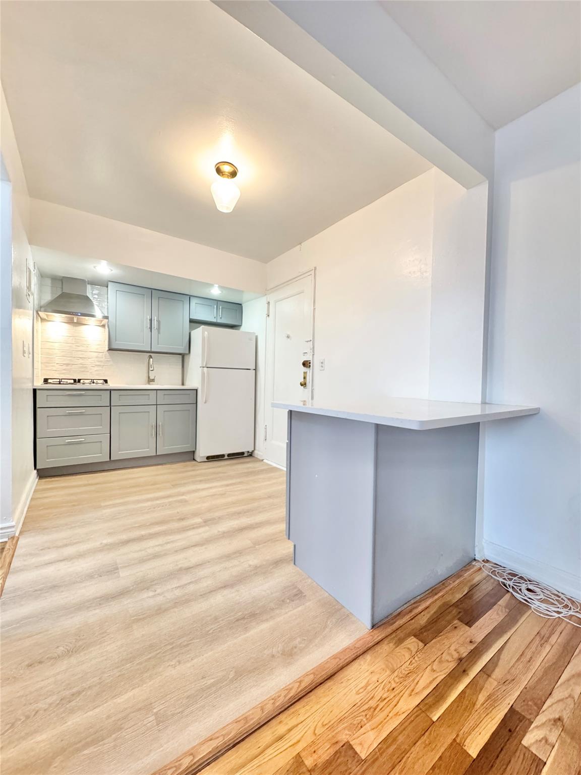 84-19 51st Avenue, Unit 4E Queens, NY 11373 - Photo 3 of 7 a view of a kitchen with a sink