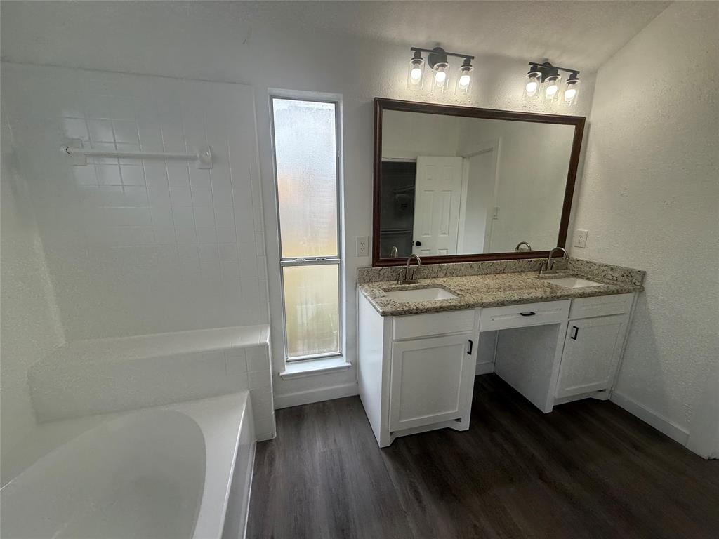 6005 Meadowdale Road Arlington, TX 76017 - Photo 16 of 20 a bathroom with a sink and a mirror