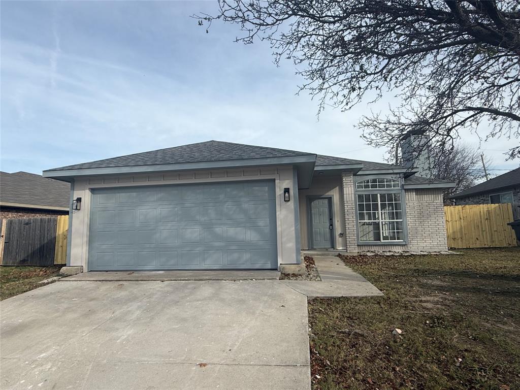 6005 Meadowdale Road Arlington, TX 76017 - Photo 2 of 20 front view of a house with a yard