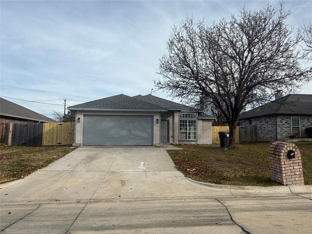 6005 Meadowdale Road Arlington, TX 76017 - Photo 3 of 20 a front view of a house with yard and trees