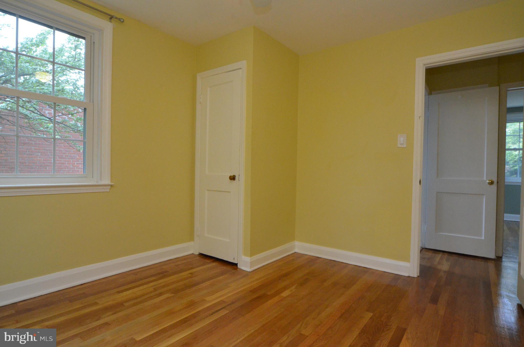 8649 Oak Road Baltimore, MD 21234 - Photo 15 of 30 a view of an empty room with wooden floor and a window