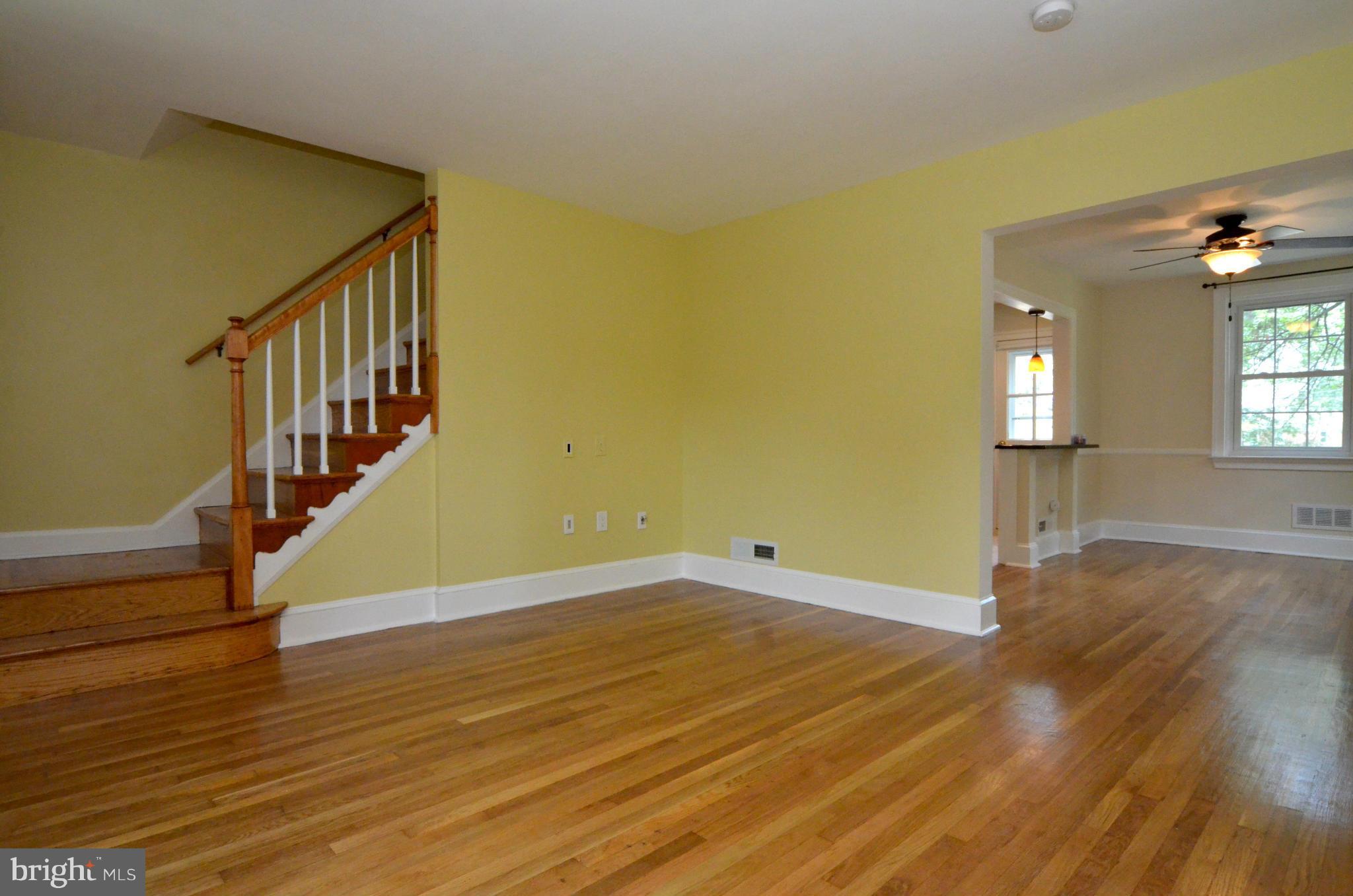 8649 Oak Road Baltimore, MD 21234 - Photo 3 of 30 a view of empty room with wooden floor and fan
