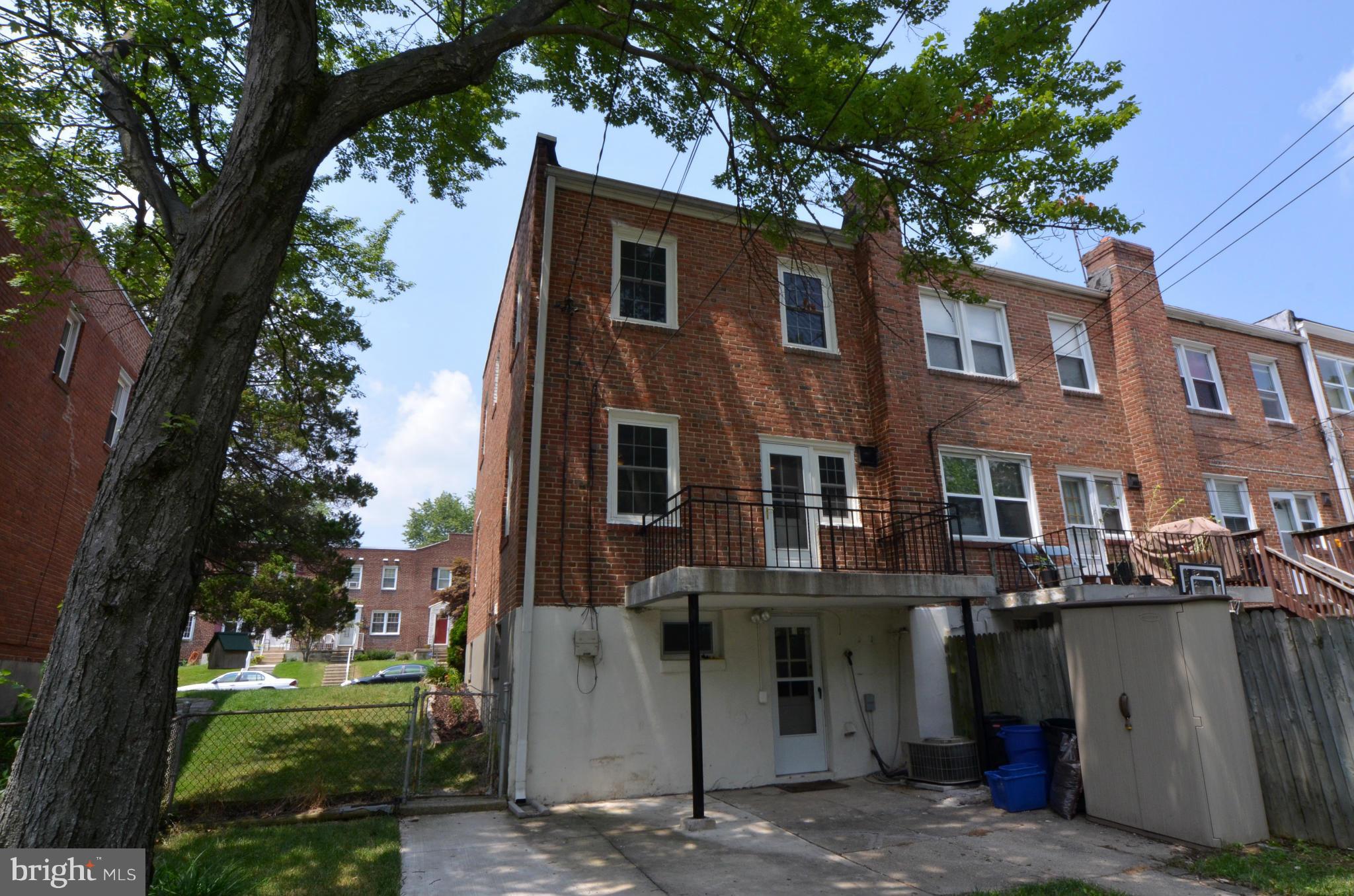 8649 Oak Road Baltimore, MD 21234 - Photo 22 of 30 a front view of a house with a garden