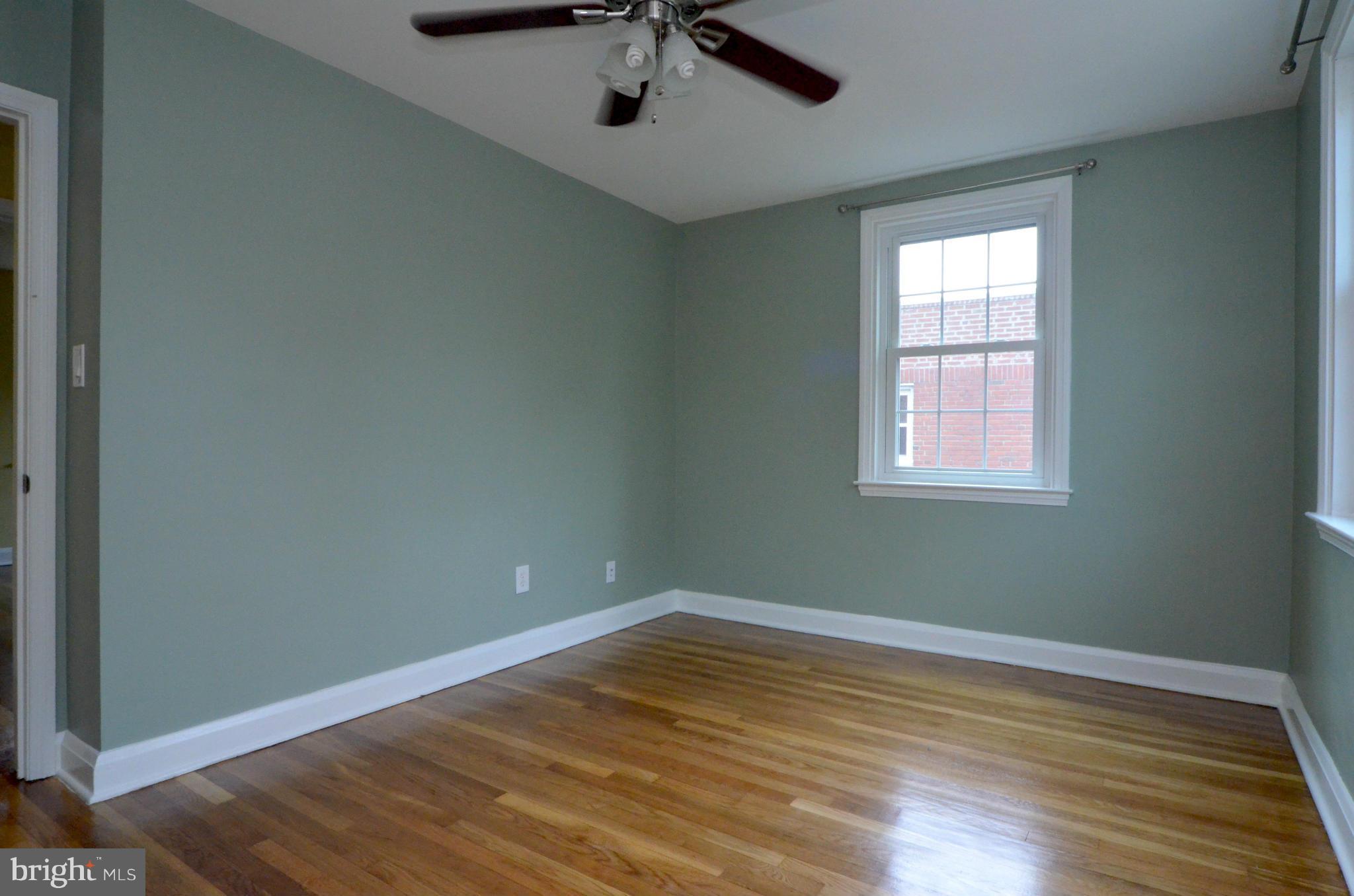 8649 Oak Road Baltimore, MD 21234 - Photo 10 of 30 wooden floor in an empty room with a window