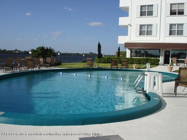 2840 South Ocean Boulevard, Unit 3230 Palm Beach, FL 33480 - Photo 14 of 18 a view of a lake with a house
