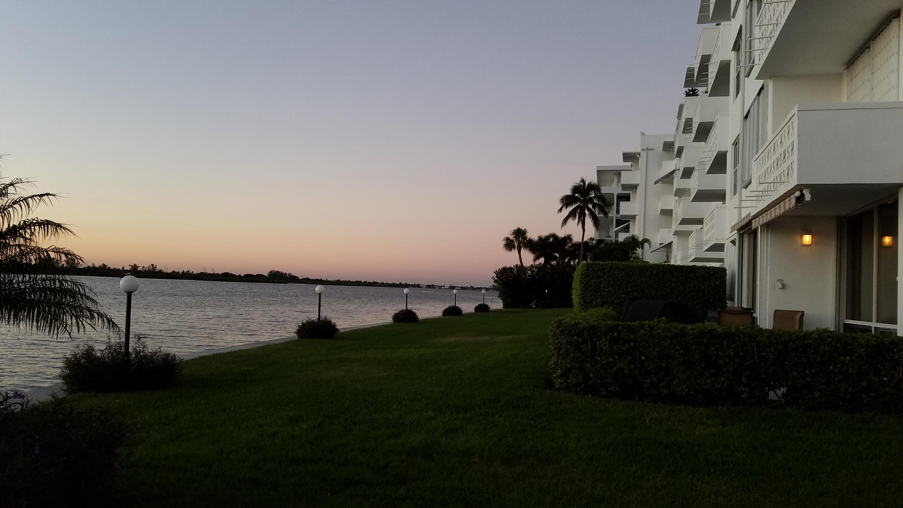 2840 South Ocean Boulevard, Unit 3230 Palm Beach, FL 33480 - Photo 2 of 18 a view of a house with backyard and lake