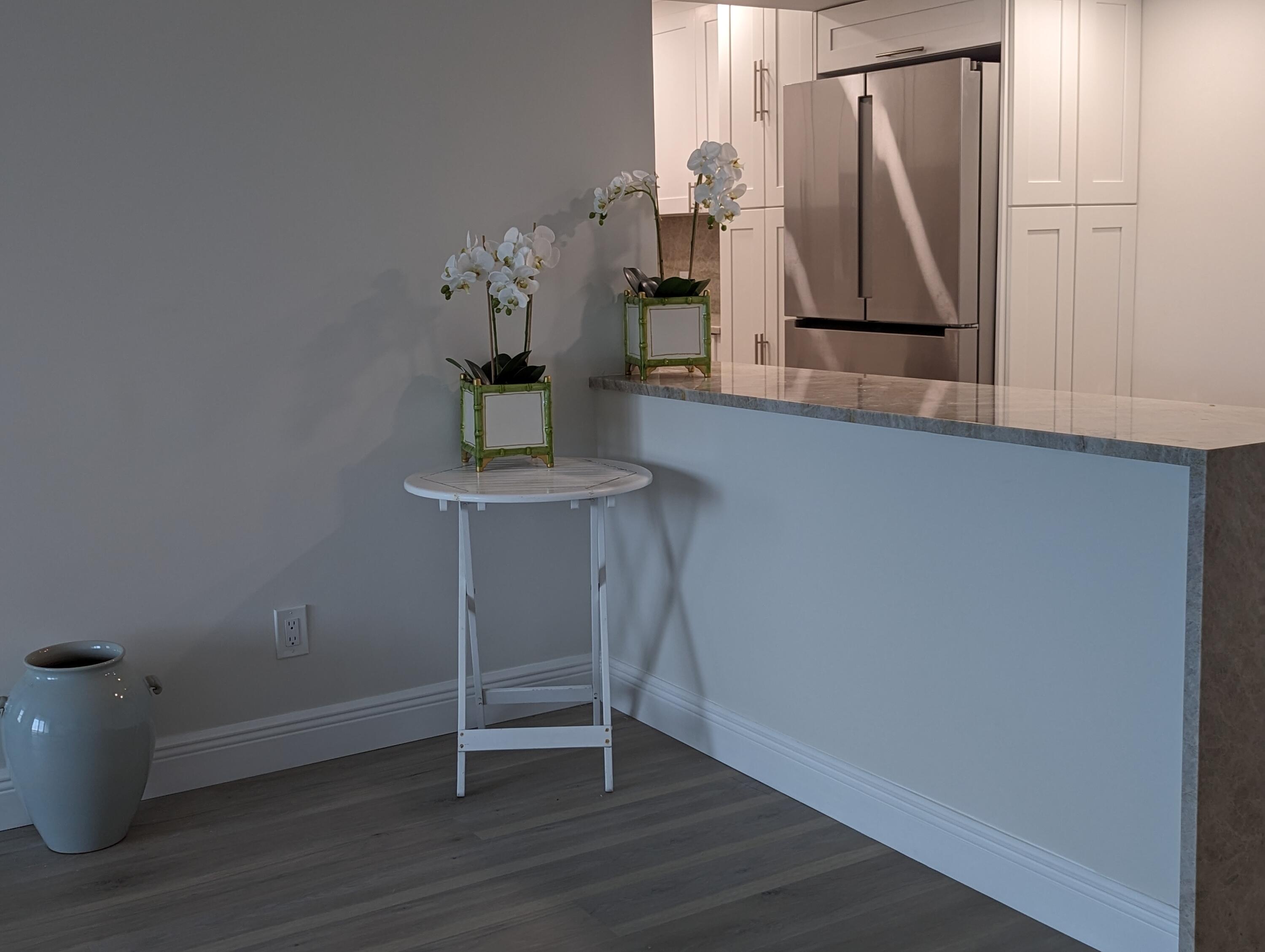 2840 South Ocean Boulevard, Unit 3230 Palm Beach, FL 33480 - Photo 6 of 18 a view of a workspace with furniture and wooden floor