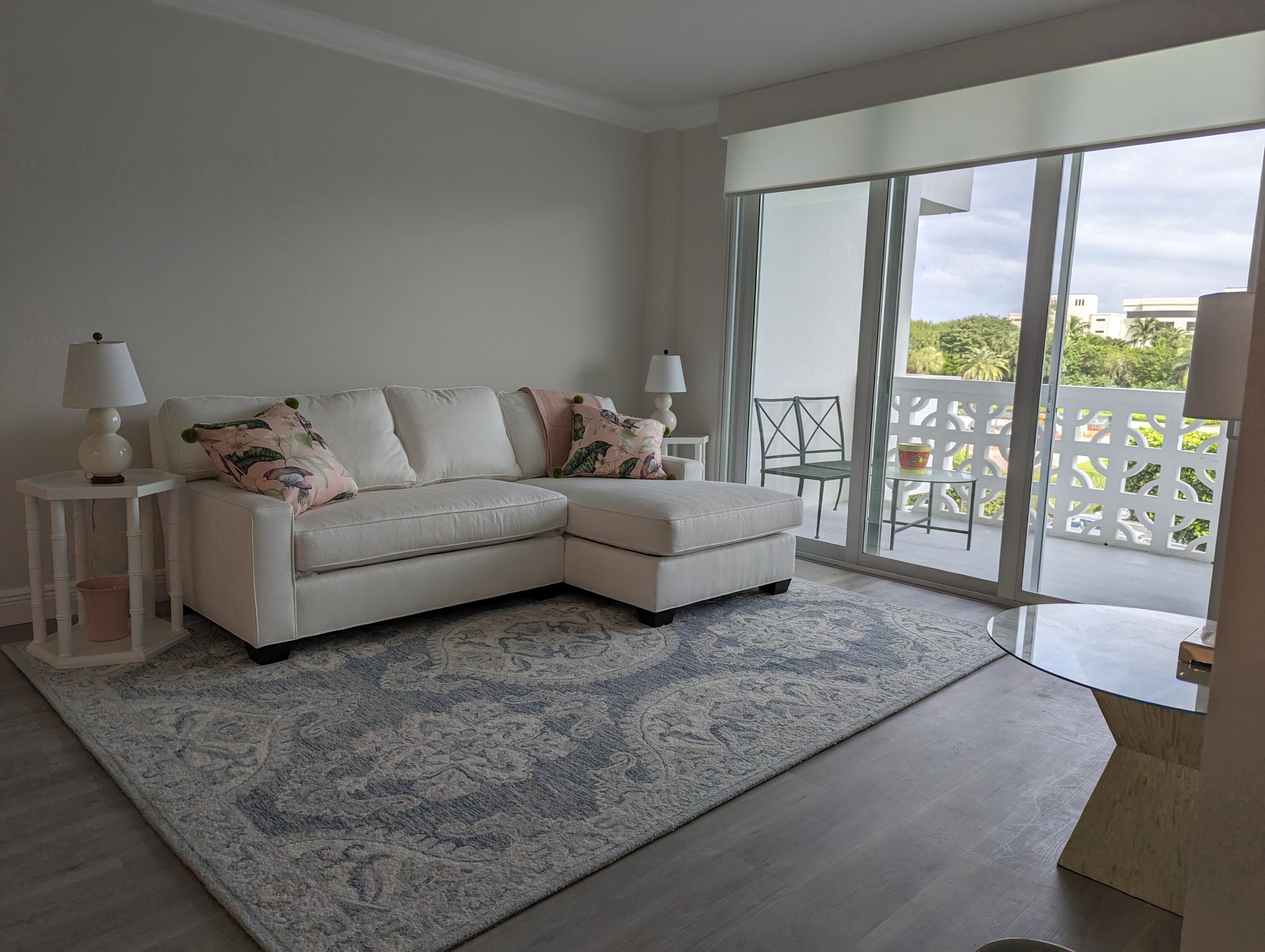 2840 South Ocean Boulevard, Unit 3230 Palm Beach, FL 33480 - Photo 7 of 18 a living room with furniture and large windows
