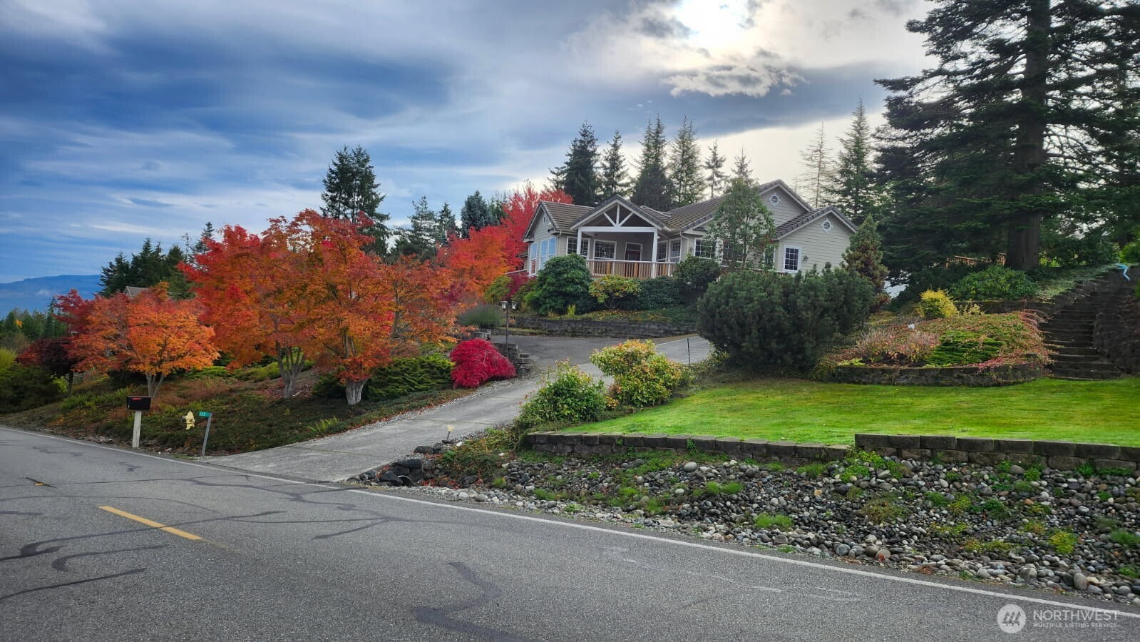 113 Quails Roost Road Sequim, WA 98382 - Photo 12 of 40 a front view of a house with a yard