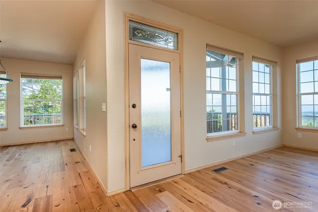 a view of a dining room with furniture window and wooden floor