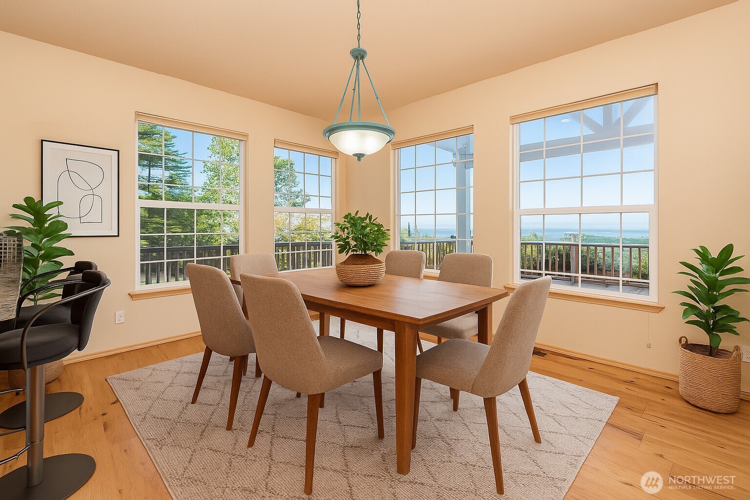113 Quails Roost Road Sequim, WA 98382 - Photo 22 of 40 a view of a dining room with furniture window and wooden floor