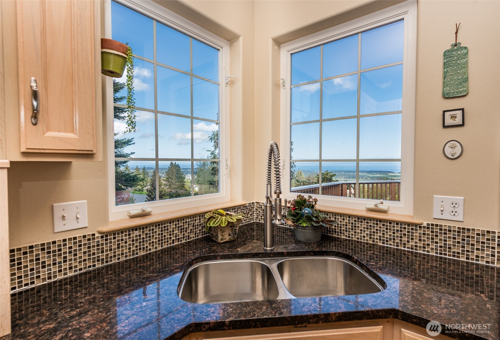 113 Quails Roost Road Sequim, WA 98382 - Photo 23 of 40 a bathroom with a sink a mirror and next to a window